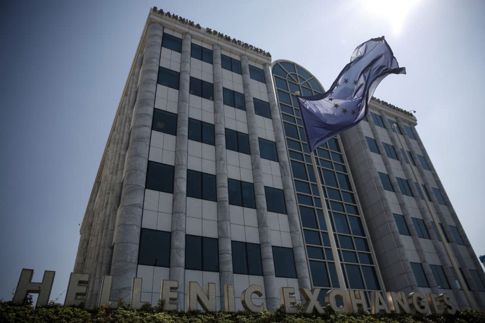 A European Union (EU) flag flutters outside the Athens' Stock Exchange in Athens, Greece, Monday, Aug. 3, 2015. Greece's main stock index plunged over 22 percent as it reopened Monday after a five-week closure, giving investors their first opportunity since June to react to the country's latest economic crisis.  (Yorgos Karahalis/AP Photo)