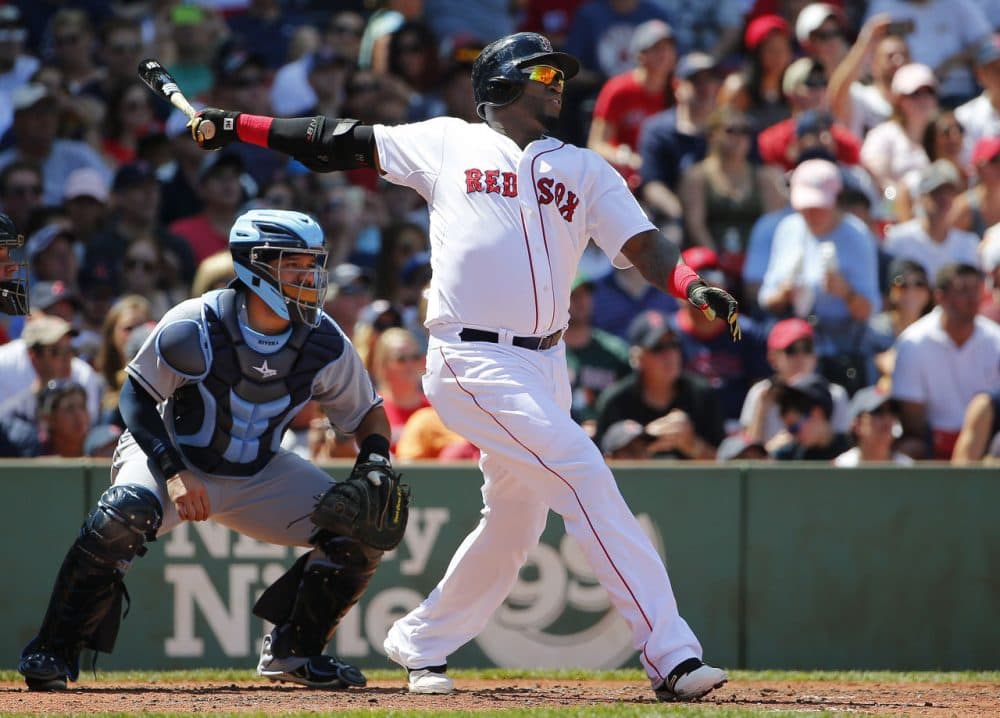 Red Sox designated hitter David Ortiz follows through on a RBI double during the third inning of a baseball game at Fenway, Sunday, Aug. 2, 2015. (Winslow Townson/AP)