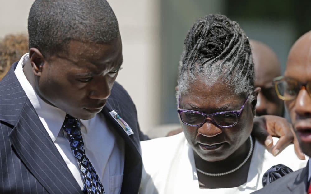 Georgia Ferrell, right, mother of Jonathan Ferrell, is hugged by her son William Ferrell, left, during a news conference on the first day of the trial of former Charlotte-Mecklenburg police Officer Randall Kerrick, in Charlotte, N.C., Monday, July 20, 2015. Investigators say Kerrick shot Jonathan Ferrell, who was unarmed, 10 times during an investigation of a possible home invasion. (Chuck Burton/AP)