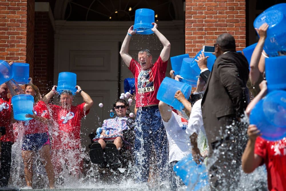 Gov. Charlie Baker takes the ALS Ice Bucket Challenge Monday afternoon on the State House steps. (Jesse Costa/WBUR)