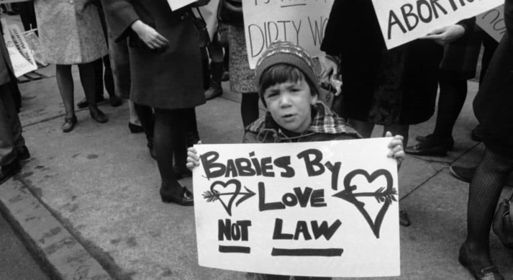 A youthful picketer voices opposition to the New York State abortion laws in Midtown Manhattan March 21, 1969, in front of Gov. Nelson A. Rockefeller’s office. (Anthony Camerano/AP)