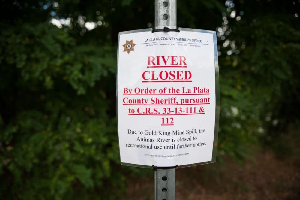  A sign is posted near the Animas River on Aug. 11 in Durango, Colorado. The Environmental Protection Agency accidentally released an estimated 3 million gallons of wastewater from the Gold King mine into the Animas last week. (Theo Stroomer/Getty Images)
