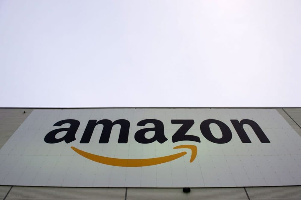 The logo of U.S. online retail giant Amazon is displayed on the Brieselang logistics center, west of Berlin on November 11, 2014. (John MacDougall/AFP/Getty Images)