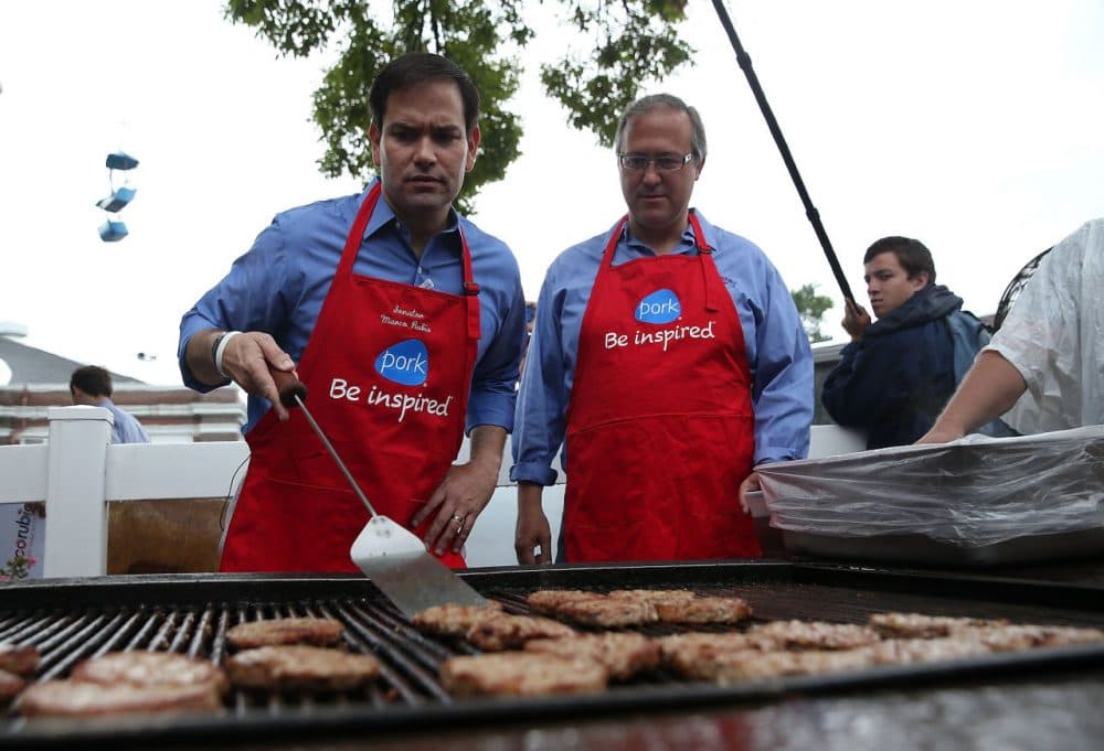 Republican presidential candidate and U.S. Sen. Marco Rubio (left) (R-FL) mans the grill with U.S. Rep. David Young (right) (R-IA) at the Iowa Pork Producers Pork Tent during the Iowa State Fair on August 18, 2015 in Des Moines, Iowa. Presidential candidates are addressing attendees at the Iowa State Fair on the Des Moines Register Presidential Soapbox stage and touring the fairgrounds. The State Fair runs through August 23. (Justin Sullivan/Getty Images)