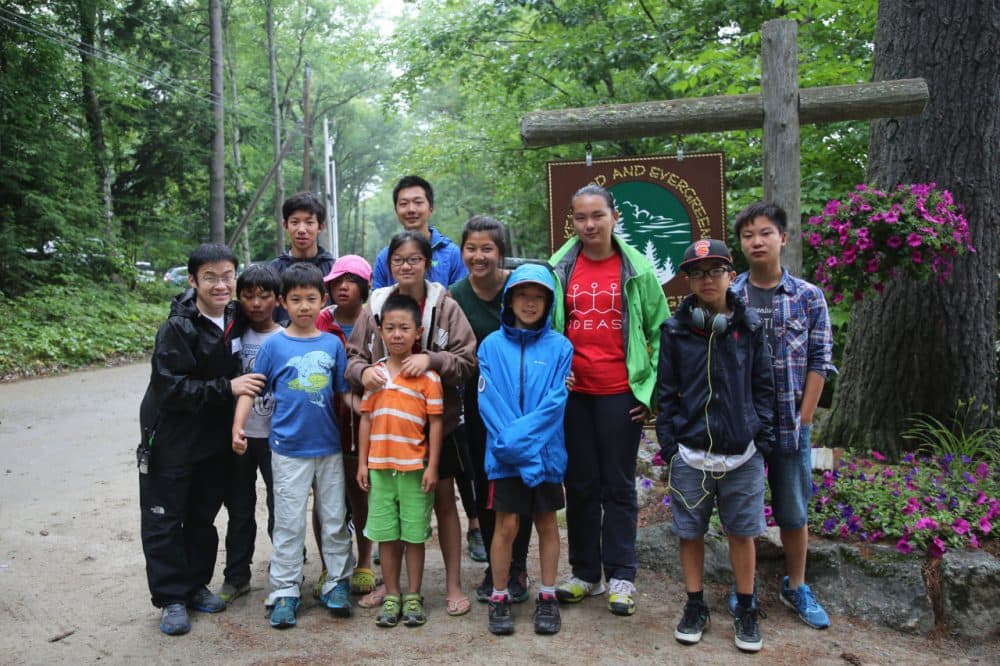 Xin Guo (left) poses for a picture with Chinese campers on the last day (there were some tears) at Camps Kenwood and Evergreen in New Hampshire this summer. (Sheila Pallay)