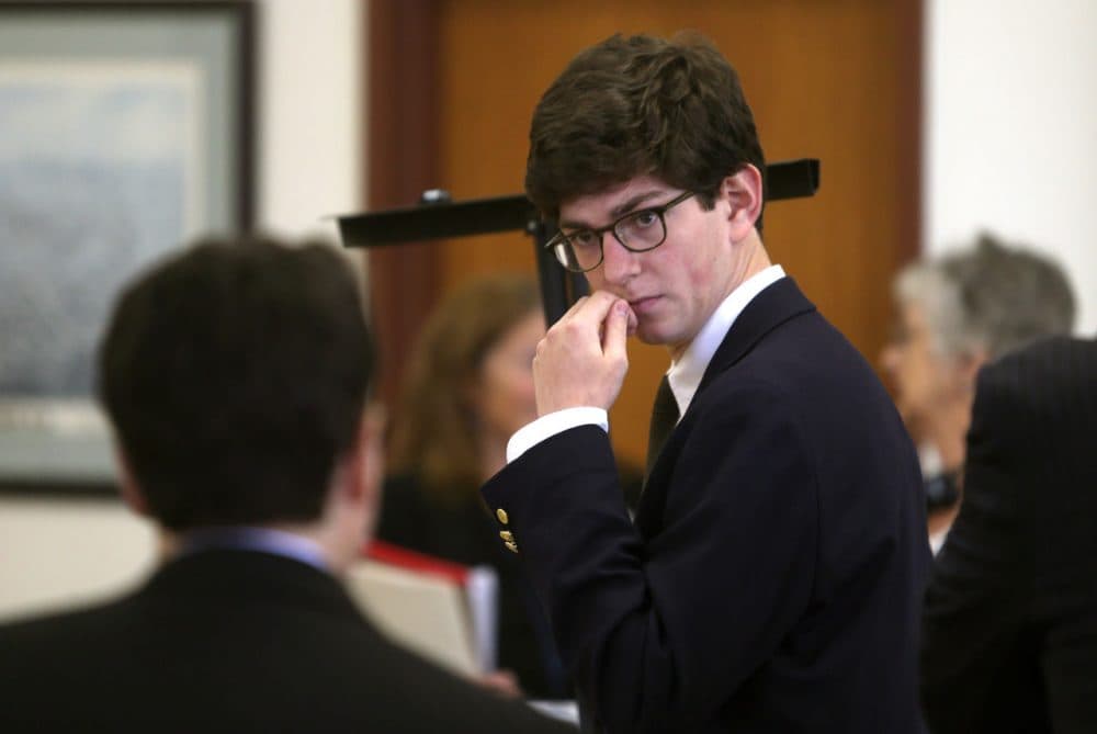 Former St. Paul's student Owen Labrie confers with his lawyer before the start of the second day of his trial at Merrimack County Superior Court in Concord, N.H., Wednesday. (Geoff Forester/The Concord Monitor/AP)
