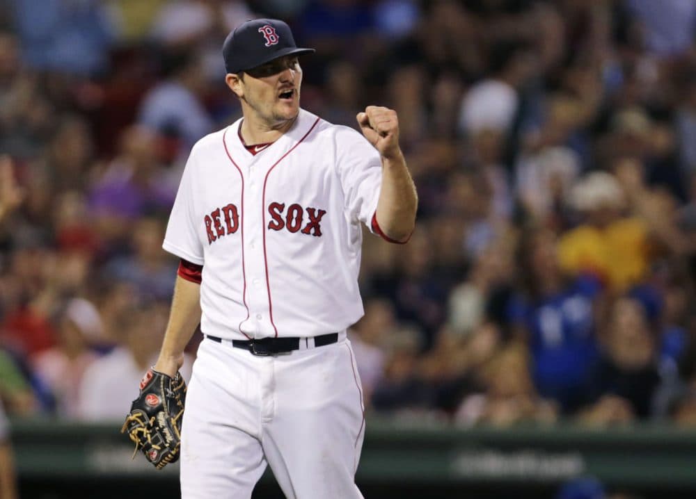 Red Sox starting pitcher Wade Miley pumps his fist after Mookie Betts snagged a line drive to end the top of the seventh inning of a game at Fenway, Thursday, Aug. 20, 2015. (Charles Krupa/AP)