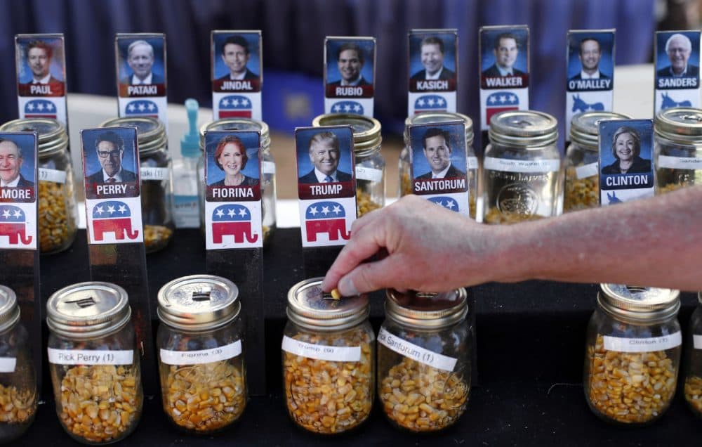 A visitor casts his vote with a kernel of corn for presidential candidate Donald Trump in a straw poll at the Iowa State Fair, Thursday, Aug. 20, 2015, in Des Moines, Iowa. (Paul Sancya/AP)