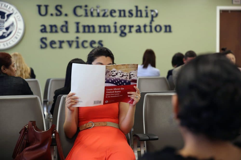 A Colombian immigrant studies ahead of her citizenship exam at the U.S. Citizenship and Immigration Services (USCIS) Queens office on May 30, 2013 in the Long Island City neighborhood of the Queens borough of New York City.   (John Moore/Getty Images)