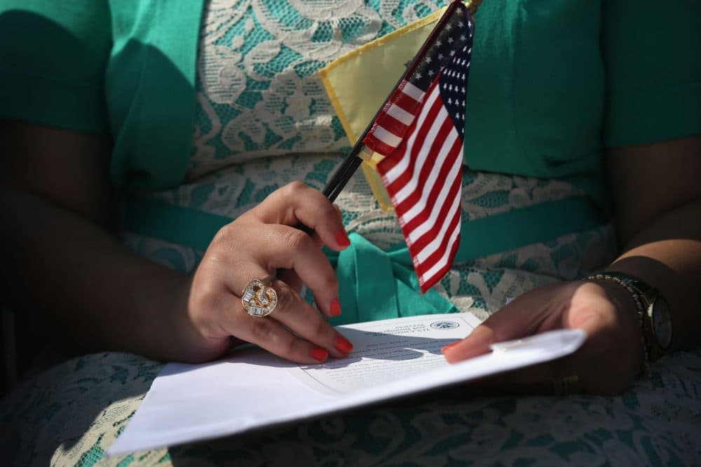 Immigrants prepare to become U.S. citizens at a naturalization ceremony at Liberty State Park on September 19, 2014 in Jersey City, New Jersey. Forty immigrants from 18 different countries became American citizens at the event, held by U.S. Citizenship and Immigration Services (USCIS), on Constitution and Citizenship Day. This week USCIS will have naturalized more than 27,000 new citizens at 160 ceremonies nationwide.  (John Moore/Getty Images)