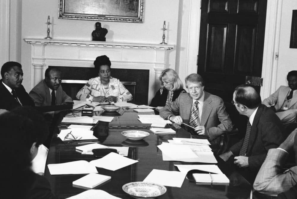 Margaret McKenna began her career as a civil rights lawyer. Here, she's pictured with President Jimmy Carter meeting with his commission for the appointment of blacks to the federal judiciary in the fifth circuit at the White House in 1977. From left: Horace Tate, Georgia state senator; Joe Reid; Mrs. Coretta King, widow of Dr. Martin Luther King; Margaret McKenna; Carter; and Attorney General Griffin Bell. (Harvey Georges/AP)