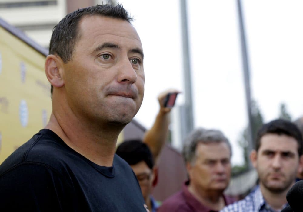 Southern California NCAA college football coach Steve Sarkisian speaks to media before football practice in Los Angeles, Tuesday, Aug. 25, 2015. Sarkisian publicly apologized for his drunken appearance at a team rally last weekend, attributing his slurred, profane speech to a combination of alcohol and medication. (Nick Ut/AP)