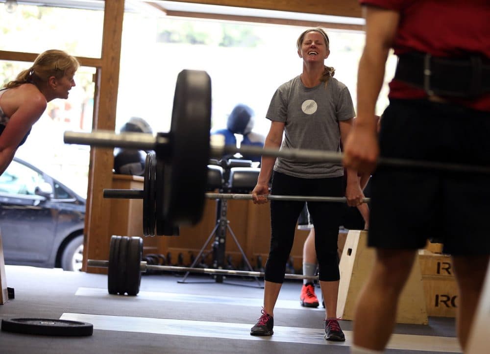 Dawn Lillington does a deadlift during a CrossFit workout at Ross Valley CrossFit on March 14, 2014 in San Anselmo, California. CrossFit, a high intensity workout regimen that is a constantly varied mix of aerobic exercise, gymnastics and Olympic weight lifting, is one of the fastest growing fitness programs in the world. The grueling cult-like core strength and conditioning program is popular with firefighters, police officers, members of the military and professional athletes. Since its inception in 2000, the number of CrossFit affiliates, or 'boxes' has skyrocketed to over 8,500 worldwide with more opening every year. (Justin Sullivan/Getty Images)
