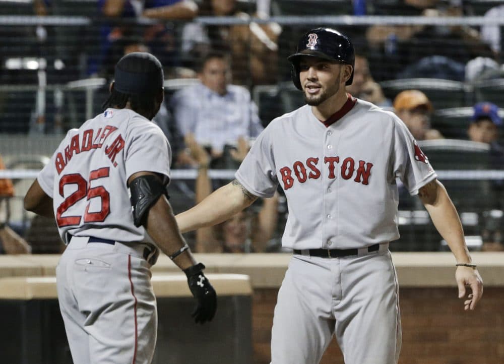 Boston Red Sox's Blake Swihart celebrates with teammate Jackie Bradley Jr. (25) after scoring on an inside-the-park home run during the 10th inning of a game against the Mets Friday. (Frank Franklin II/AP)