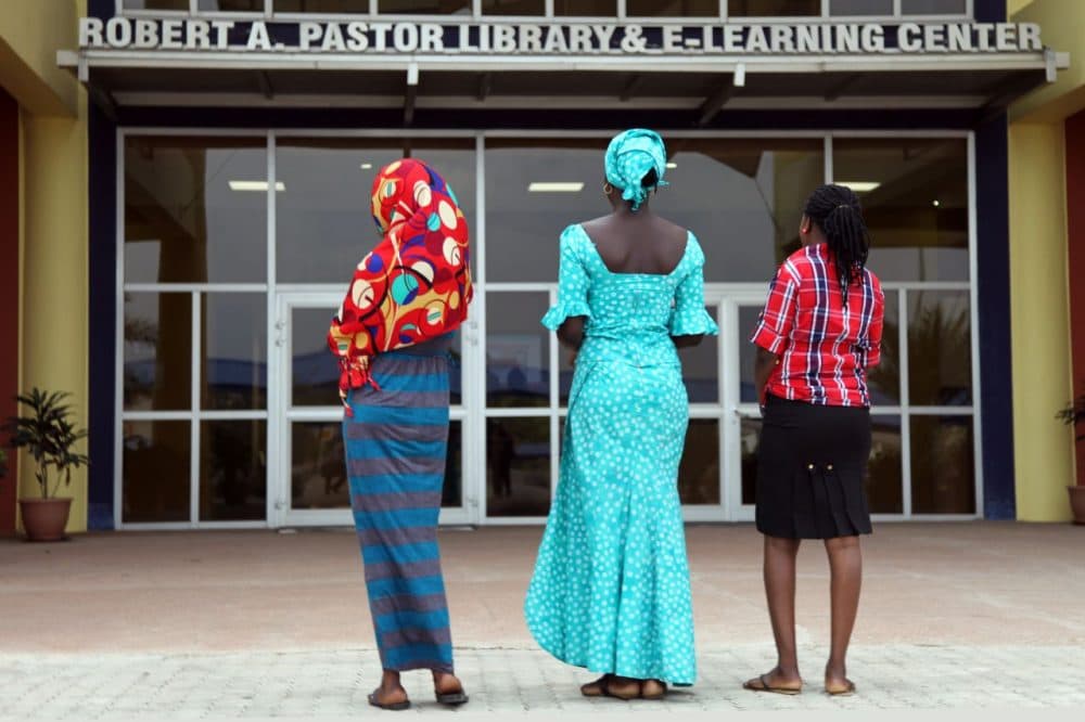 Three teenagers who escaped a Boko Haram mass kidnapping in the northeast Nigerian town of Chibok last year are seen at the American University of Nigeria, in the Adamawa state capital, Yola, on May 8, 2015. Deborah (red headscarf), Blessing (green dress and headscarf) and Mary were among 57 who fled the kidnappers, after they seized 219 girls on April 14 last year. The young women -- who were using their middle names and asked their faces not be shown -- are now studying to sit their secondary school exams interrupted by the attack with a view to a degree course at the university. (Emmanuel Arewa/AFP/Getty Images)