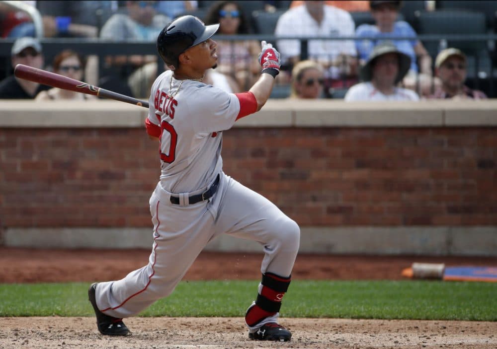 Red Sox's Mookie Betts hits a seventh-inning RBI-triple against the Mets in New York, Sunday, Aug. 30, 2015. (Kathy Willens/AP)