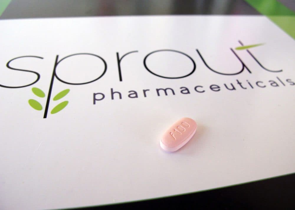 In this June 22 photo, a tablet of Flibanserin sits on a brochure for Sprout Pharmaceuticals in the company's Raleigh, N.C., headquarters. (Allen G. Breed/AP)