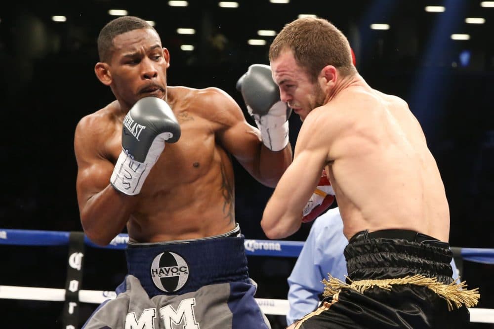 Danny Jacobs (left) has a big fight on Saturday, as he is looking to retain his middleweight title Saturday. But the biggest fight of his life came four years ago, when Jacobs had to take down cancer. (Ed Mulholland/Getty Images)