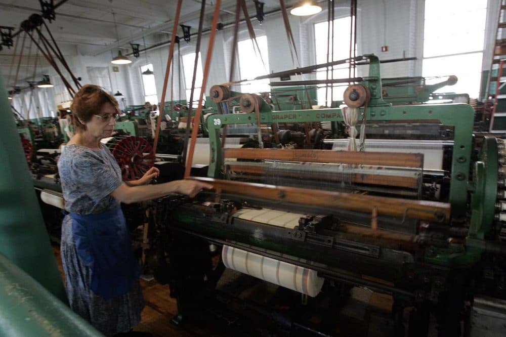 Francisca Desousa demonstrates looms at Boott Cotton Mills Museum in the Lowell National Historic Park. (Chitose Suzuki/AP)