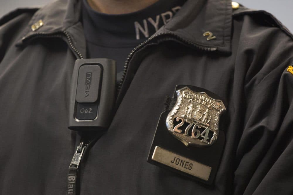New York Police Department officer Joshua Jones wears a VieVu body camera on his chest as part of a pilot program. (Mark Lennihan/AP)