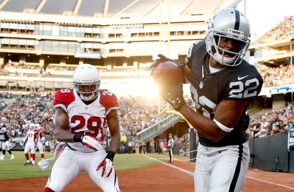 Taiwan Jones #22 of the Oakland Raiders tries to catch the ball in the endzone while covered by Chris Clemons #29 of the Arizona Cardinals at O.co Coliseum on August 30, 2015 in Oakland, California. (Ezra Shaw/Getty Images)