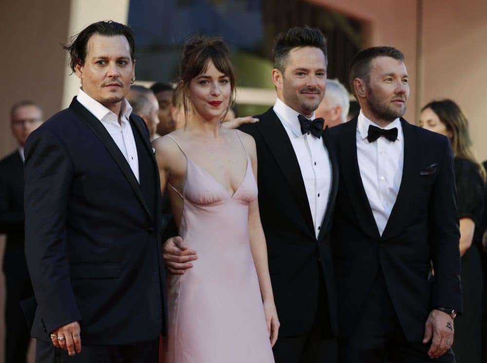 From left, actors Johnny Depp, Dakota Johnson, director Scott Cooper and actor Joel Edgerton at the screening of the movie &quot;Black Mass&quot; at the Venice Film Festival in Italy on Sept. 4 (Andrew Medichini/AP)