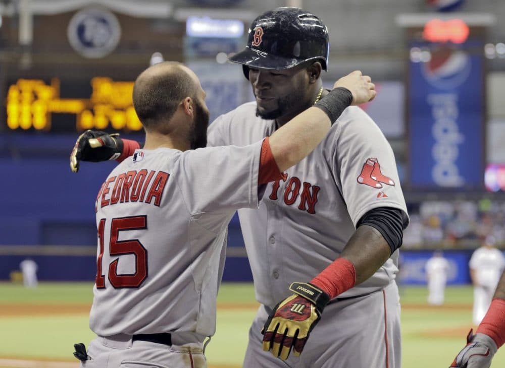 Boston Red Sox's David Ortiz, right, hugs Dustin Pedroia after Ortiz hit his 500th career home run off Tampa Bay Rays starting pitcher Matt Moore during the fifth inning Saturday in St. Petersburg, Fla. (Chris O'Meara/AP)