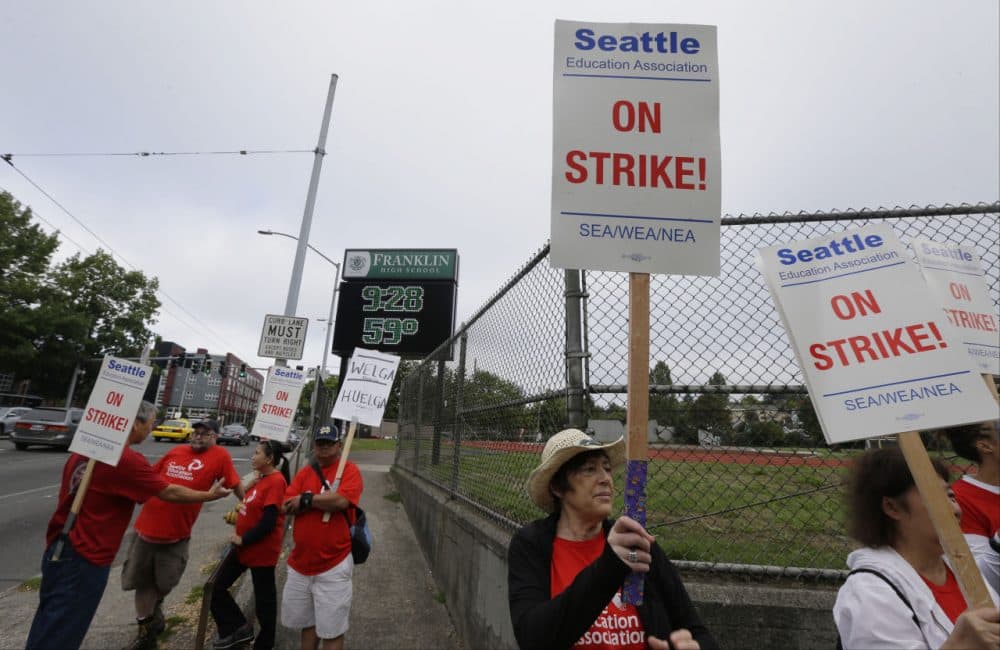 Striking Seattle School District teachers and other educators walk a picket line, Thursday, Sept. 10, 2015, near Franklin High School in Seattle. (Ted S. Warren/AP)
