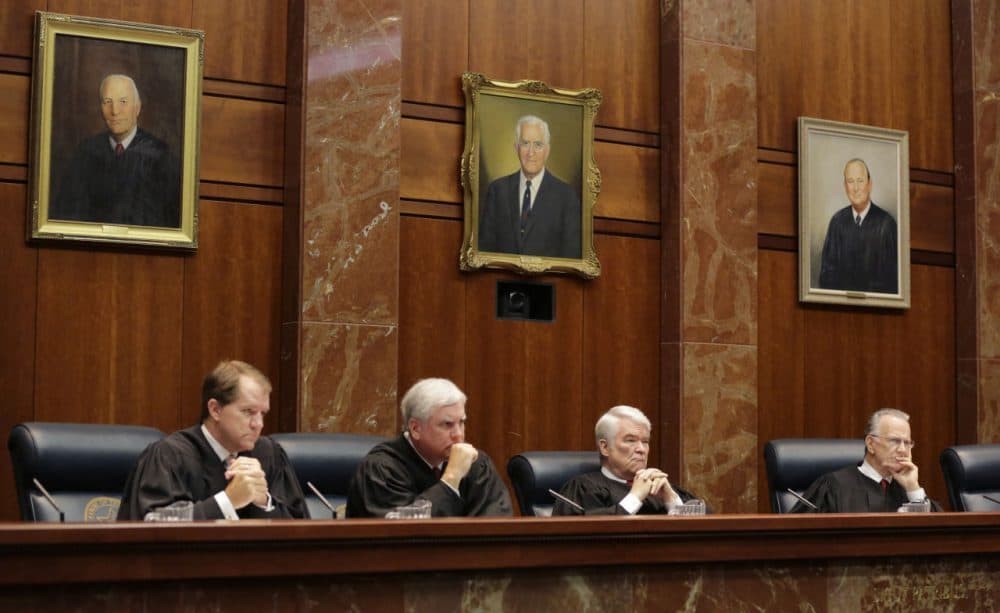 Texas Supreme Court Justices  listen to oral arguments in Texas' latest school finance trial at the state Supreme Court, Tuesday, Sept. 1, 2015, in Austin, Texas. Attorneys for more than 600 school districts suing Texas argue that the funding is inadequate and unfairly distributed, making it hard for students and schools to meet stringent academic standards.  (Eric Gay/Pool/AP Images)