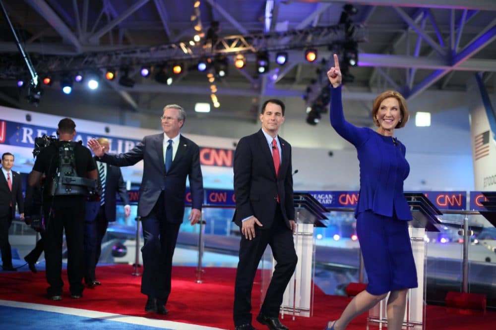 Republican presidential candidates (right to left) Carly Fiorina, Wisconsin Gov. Scott Walker and Jeb Bush walk onstage for the GOP debate on Wednesday night. (Sandy Huffaker/Getty Images)