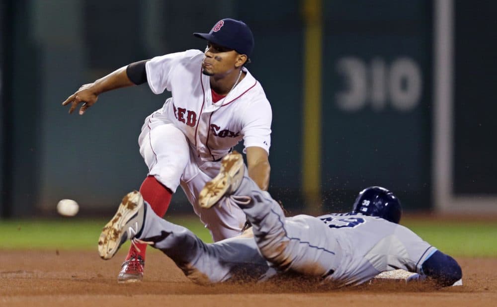 Boston Red Sox shortstop Xander Bogaerts sets to make the tag while catching Tampa Bay Rays' Kevin Kiermaier trying to steal second base at a game at Fenway Park on Thursday. (Charles Krupa/AP)