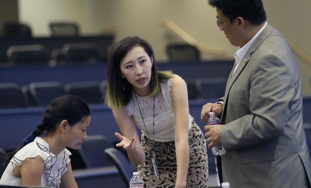 Hua Bai, center, vice president of Friendship Association of Chinese Scholars and Students, prepares for an orientation for fellow Chinese students at the University of Texas at Dallas in Richardson, Texas, Aug. 22, 2015. Bai came from China last year to work on a master’s degree in marketing and information technology management. The 25-year-old said that given the right opportunity, she’d like to stay in the U.S. Census Bureau research shows immigrants from China and India, many with student or work visas, have overtaken Mexicans as the largest groups coming into the U.S. (LM Otero/AP)