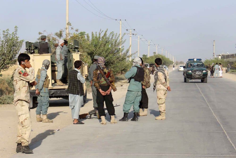 Afghan security forces gather at the roadside a day after Taliban insurgents overran the strategic northern city of Kunduz, on September 29, 2015.  Afghanistan on September 29, 2015, mobilized reinforcements for a counter-offensive to take back Kunduz, a day after Taliban insurgents overran the strategic northern city in their biggest victory since being ousted from power in 2001. (STR/AFP/Getty Images)