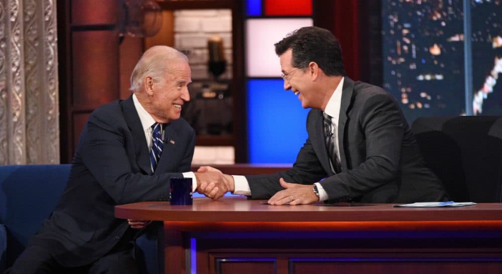 In this image released by CBS, host Stephen Colbert, right, shakes hands with Vice President Joe Biden during a taping of “The Late Show with Stephen Colbert,” on Thursday, Sept. 10, 2015. (AP)