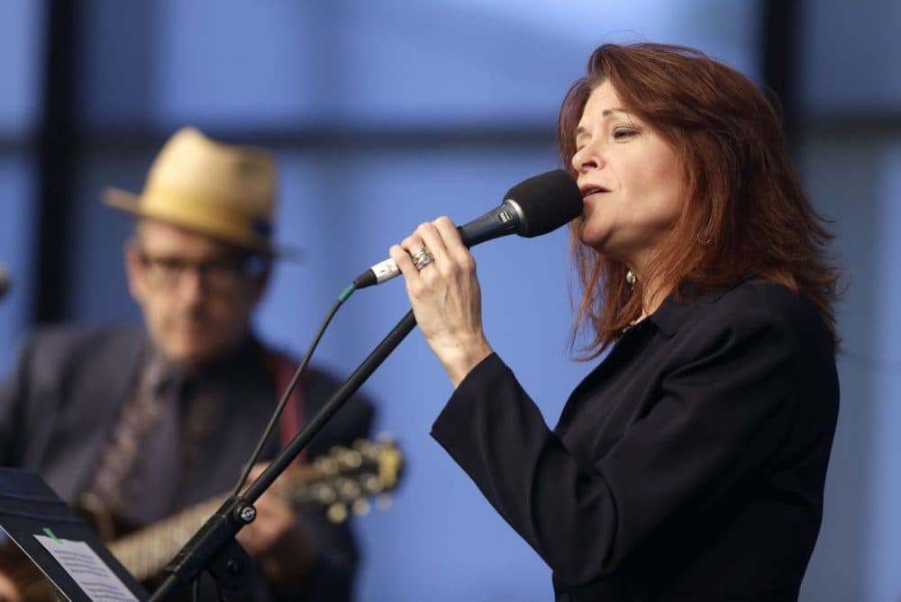 Singer and songwriters Rosanne Cash, right, performs at the John F. Kennedy Library and Museum in June 2014, in Boston. (Steven Senne/AP)