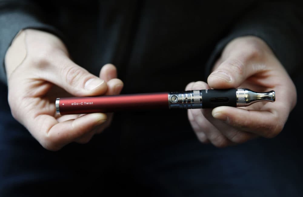 Beginning Sept. 25, those under the age of 18 will no longer be allowed to purchase electronic cigarettes, like the one pictured here, in Massachusetts. (Nam Y. Huh/AP/File)