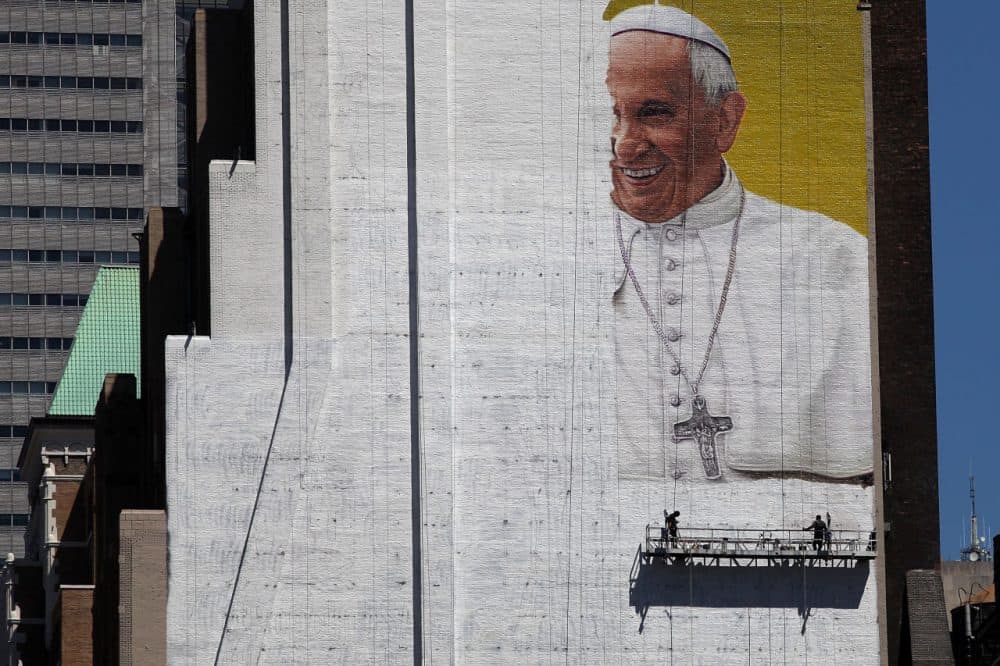A partially completed mural of Pope Francis on the side of a building in midtown Manhattan on August 28, 2015. The Pope will be making his first trip to the United States on a three-city, five-day tour that will include Washington, D.C., New York City and Philadelphia. (Spencer Platt/Getty Images)