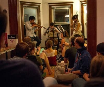 Groupmuse is an organization that brings classical music into homes. Here is a recent Groupmuse party in Somerville. (Hadley Green for WBUR)