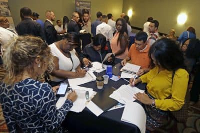 In this photo taken, Wednesday, July 15, 2015, job seekers attend a job fair in Miami Lakes, Fla. The Labor Department reports on the number of people who applied for unemployment benefits for the week ending July 11 on Thursday, July 16, 2015.  (AP)