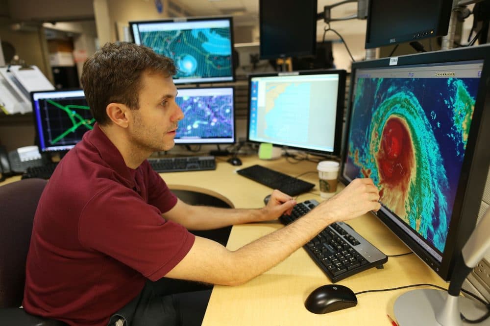 Hurricane specialist Eric Blake uses a computer at the National Hurricane Center to track the path of Hurricane Joaquin, a Category 3 storm with maximum sustained winds of 125 mph, as it passes over parts of the Bahamas on October 1, 2015 in Miami, Florida. The National Hurricane Center forecasters are still trying to determine if the hurricane will turn to the north and northwest, which might affect the U.S. East Coast. (Joe Raedle/Getty Images)