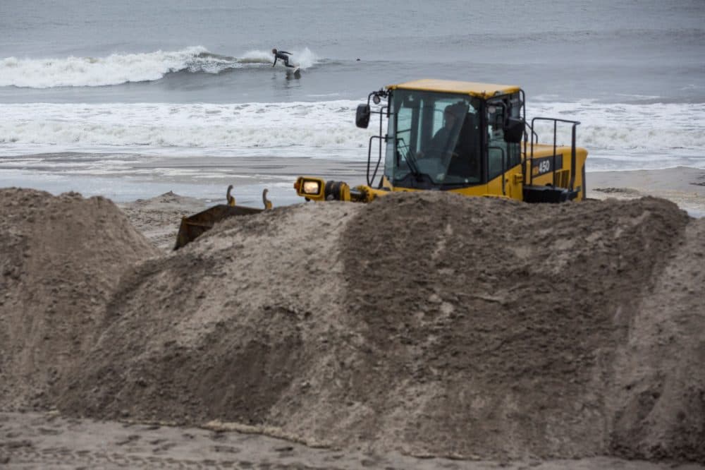 A bull dozer builds sand berms on the beach in preparation for Hurricane Joaquin in Long Beach, New York. The category 4 storm is currently near the Bahamas and has the potential to make landfall in the Long Island region early next week.  (Andrew Burton/Getty Images)