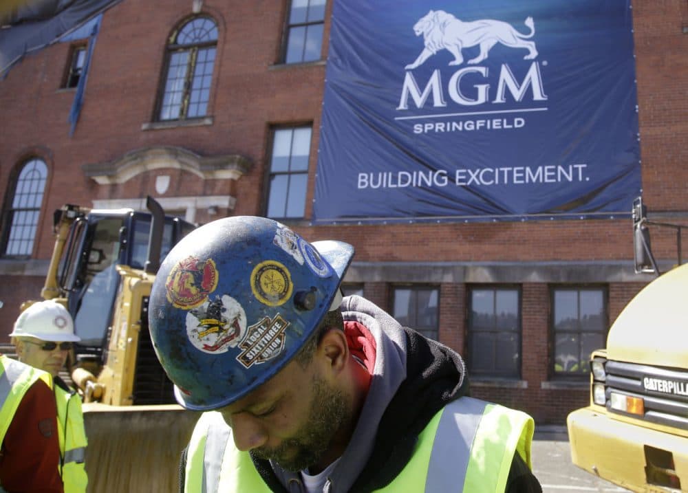 In this March 2015 photo Anthony Wallace, a member of sheet metal worker's Local 63, waits with a group of co-workers the ground breaking ceremony for the $800 million MGM casino resort. (Stephan Savoia/AP)