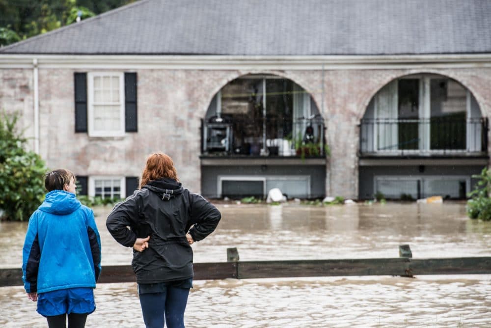 People look out over damage caused by flood water October 4, 2015 in Columbia, South Carolina. (Sean Rayford/Getty Images)