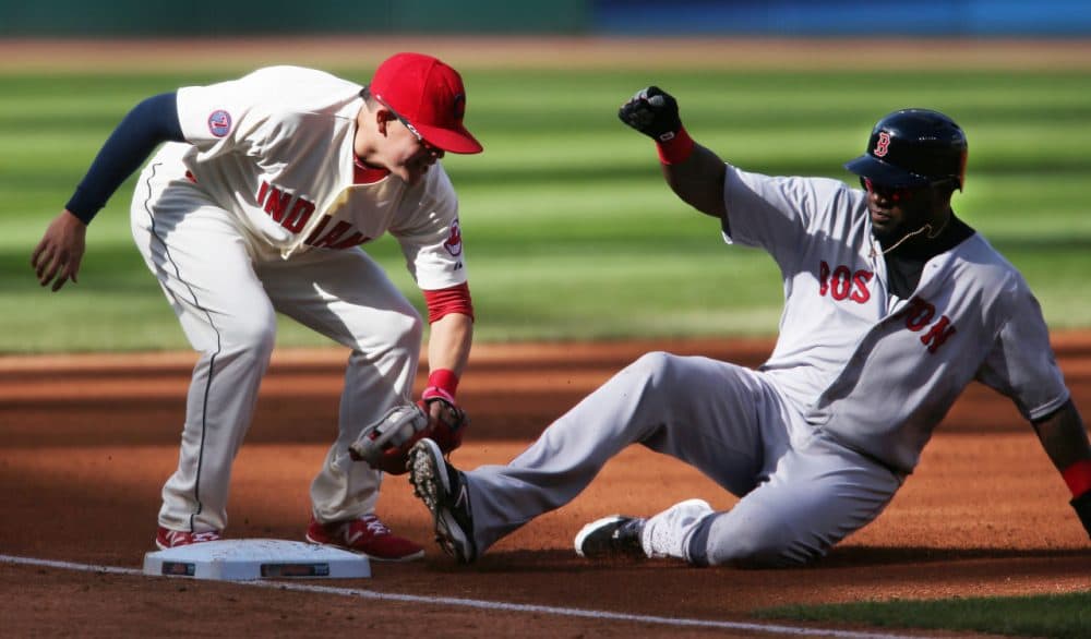 David Ortiz, right, is tagged out by Cleveland Indians Giovanny Urshela while attempting to steal third base during the first inning of a baseball game, Sunday, Oct. 4, 2015, in Cleveland. The Red Sox lost the game 3-1. (Ron Schwane/AP)