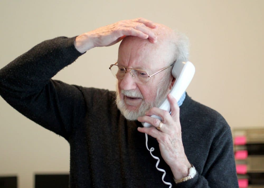 Scientist William C. Campbell talks on the phone at his home in North Andover Monday. (Mary Schwalm/AP)