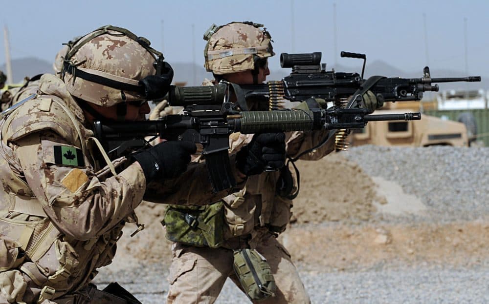 Canadian soldiers with the NATO-led International Security Assistance Force (ISAF) fire their weapons during an exercise at the base of Provincial Reconstruction Team (PRT) in Kandahar Province on March 26, 2008. (Shah Marai/AFP/Getty Images)