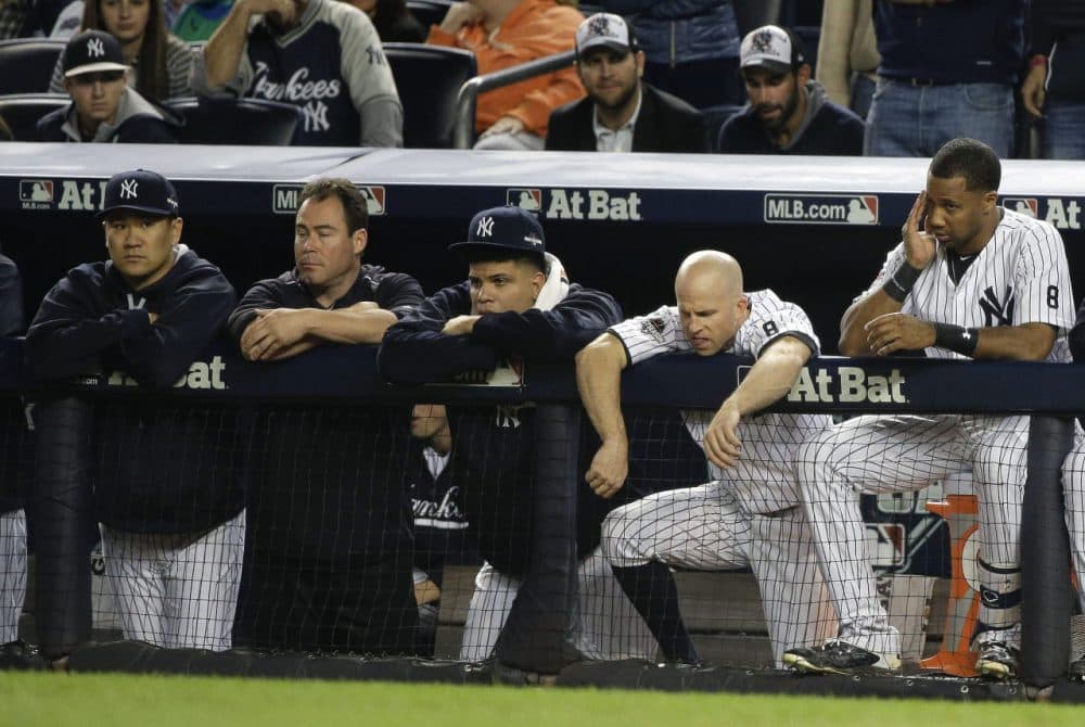 New York Yankees pitcher Masahiro Tanaka, Dellin Betances, Brett Gardner and Chris Young watch the ninth inning of the American League wild card baseball game, Tuesday. (Julie Jacobson/AP)