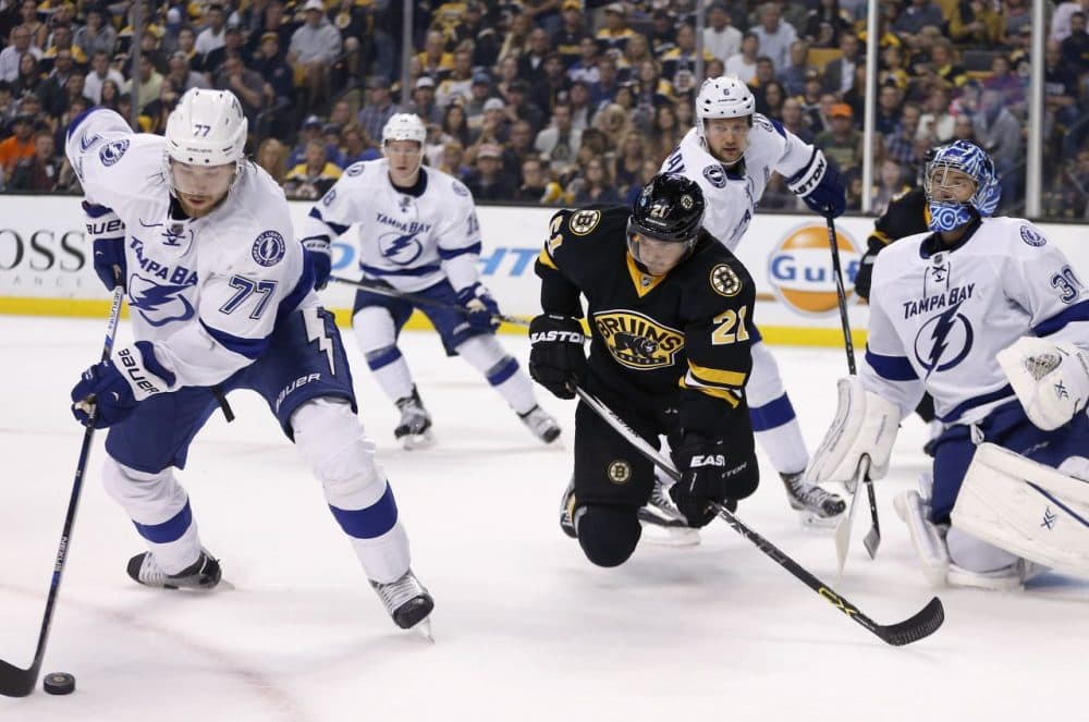 Tampa Bay Lightning's Victor Hedman (77) moves to clear the puck in front of Boston Bruins' Loui Eriksson (21) during the second period of a game in Boston, Monday. (Michael Dwyer/AP)