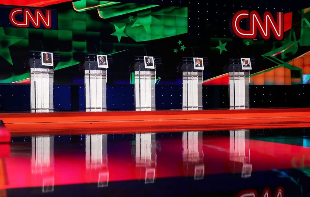 Photographs of Democratic presidential candidates, (left to right) former U.S. Sen. Jim Webb (D-VA), U.S. Sen. Bernie Sanders (I-VT), former Secretary of State Hillary Clinton, former Maryland Gov. Martin O’Malley and former Gov. of Rhode Island Lincoln Chafee hang on their debate podiums a day before the CNN Facebook Democratic Debate at the Wynn Las Vegas in Las Vegas, Nevada. (Joe Raedle/Getty Images)
