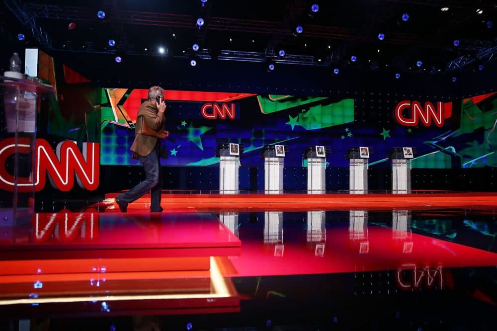A person walks on the stage set up for the Democratic presidential candidates, former U.S. Sen. Jim Webb (D-VA), U.S. Sen. Bernie Sanders (I-VT), Hillary Clinton, Former Maryland Gov. Martin O'Malley and former governor of Rhode Island Lincoln Chafee, a day before the CNN Facebook Democratic Debate at the Wynn Las Vegas on October 12, 2015 in Las Vegas, Nevada. The debate is scheduled for tomorrow and is the first debate for the Democratic presidential contenders. (Joe Raedle/Getty Images)